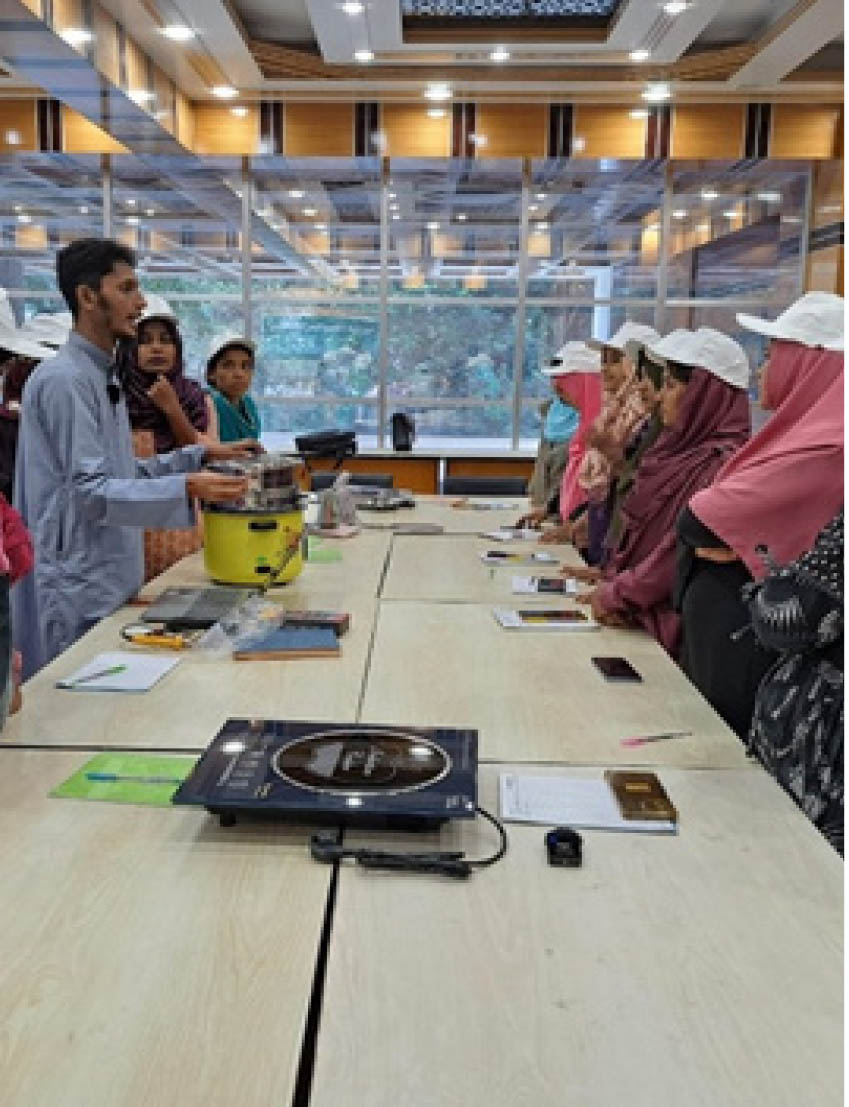 Electric induction cooker training and demonstration session with women participants