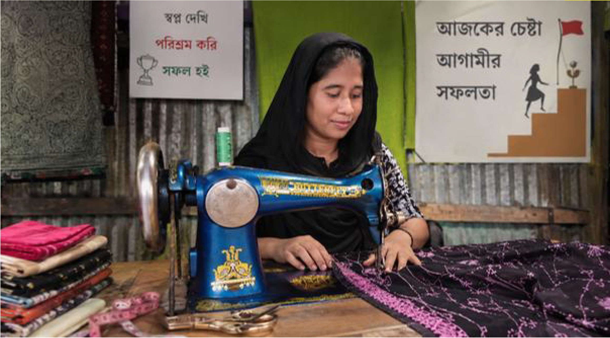 Shila Aktar working on her sewing machine